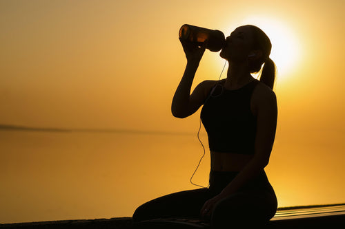 girl drinking protein supplement